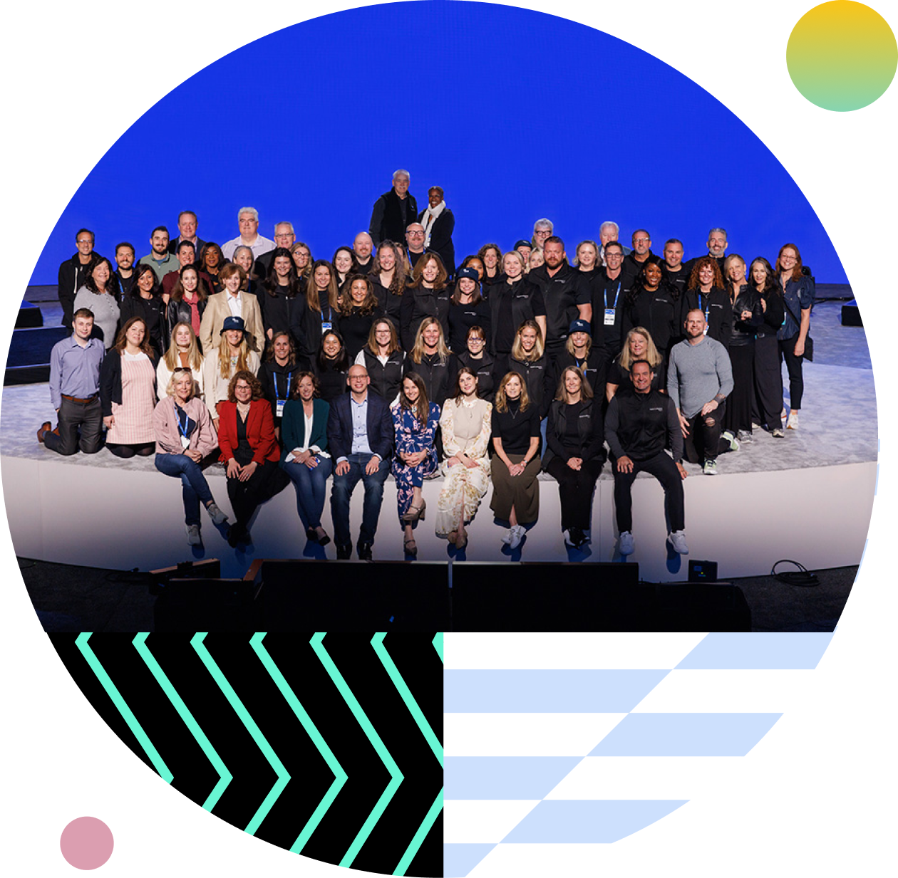 Large group of RSAC team members posing together on stage against a blue backdrop, framed by a circular design with colorful geometric patterns.