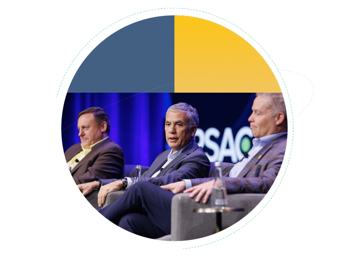 Three male panelists seated on stage during an RSAC conference discussion, framed by a circular design with yellow and blue geometric accents.