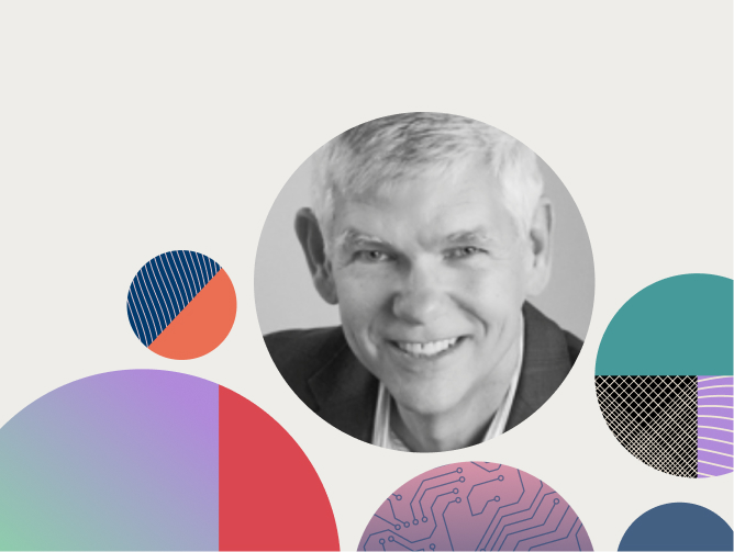 Black-and-white headshot of a smiling older man with short gray hair, surrounded by colorful circular geometric patterns.