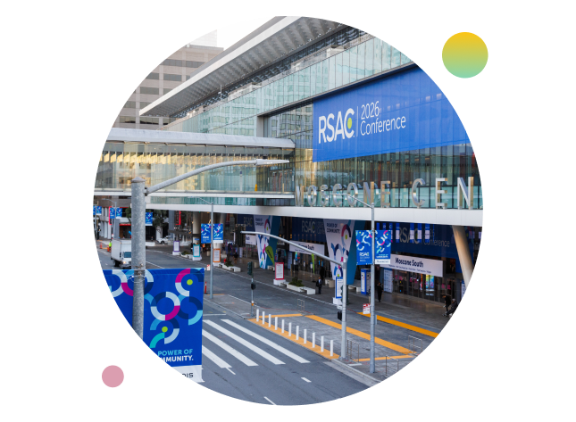 Exterior view of the Moscone Center in San Francisco featuring large RSAC 2026 Conference banners and colorful event signage.